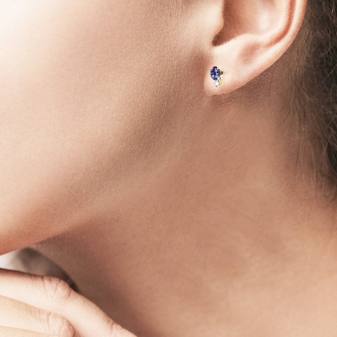Side view of the alexandrite and moissanite stud earring on the earlobe | Sada Jewels