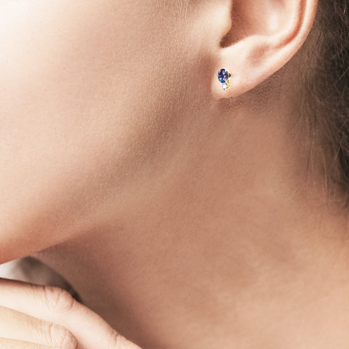 Side view of the alexandrite and moissanite stud earring on the earlobe | Sada Jewels