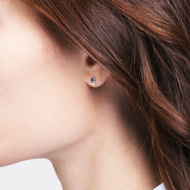 Profile of a model wearing the dainty alexandrite gold stud earring | Sada Jewels