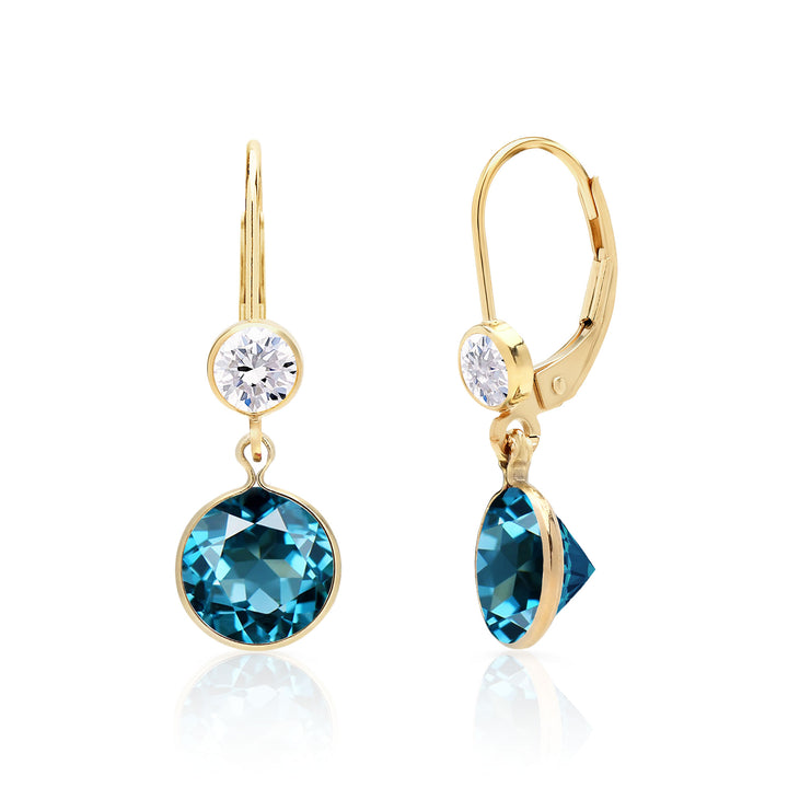 Luxurious London blue topaz earrings featuring 8mm round teal gems in an open-back bezel setting, with white topaz accented leverbacks, in 14K gold-fill or sterling silver. 