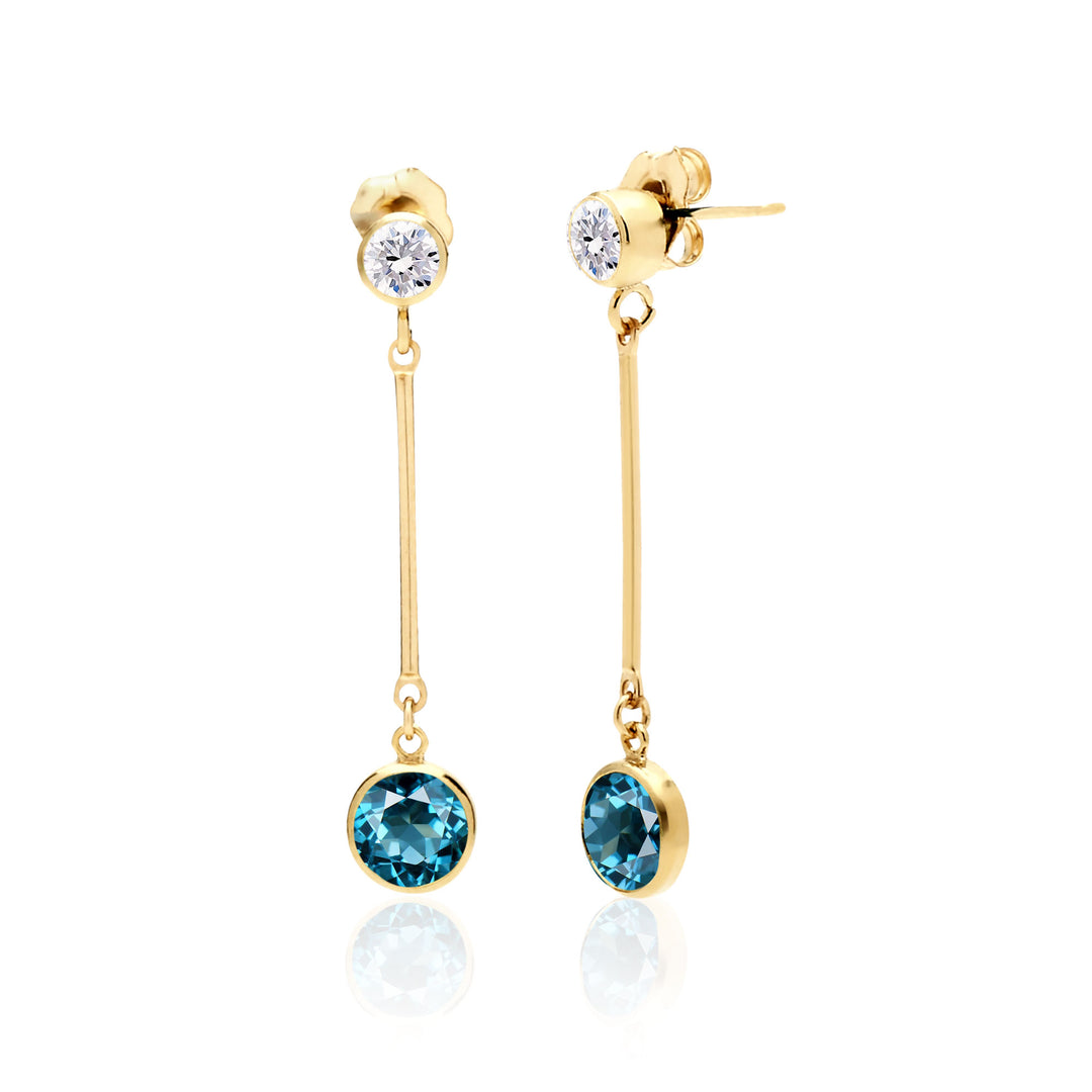 Handcrafted AAA-quality 6mm London Blue Topaz earrings with 4mm White Topaz studs in bezel settings, separated by gold bars, available in both 14K Gold Filled and Sterling Silver. Unique December birthstone and 4th Anniversary jewelry gift.